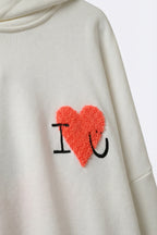 Cream Super-Soft Hoodie with Bouclé Heart Graphic