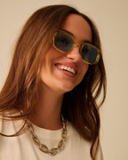 Oval Sunglasses with High Gloss Transparent Frames in Yellow