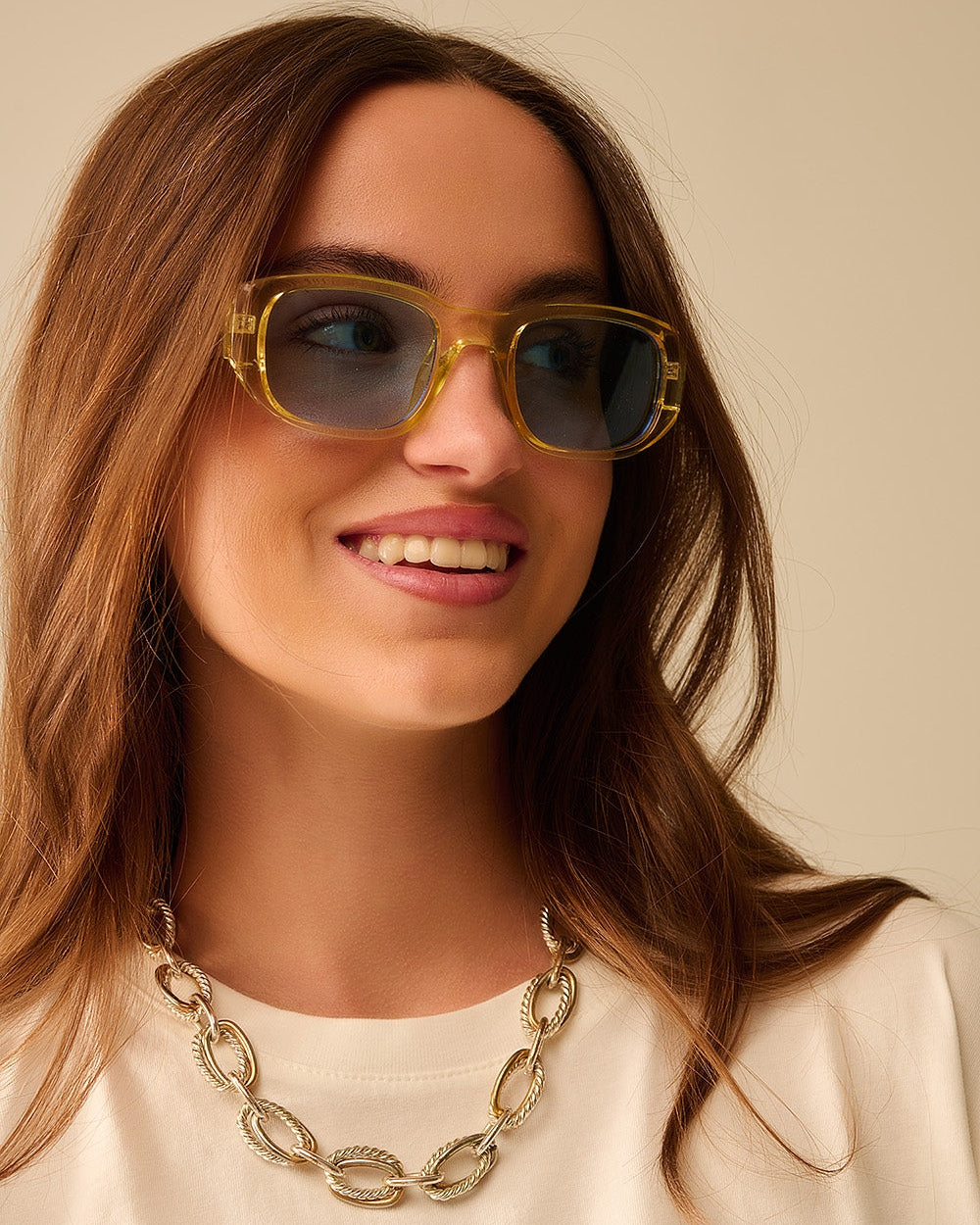 Oval Sunglasses with High Gloss Transparent Frames in Yellow