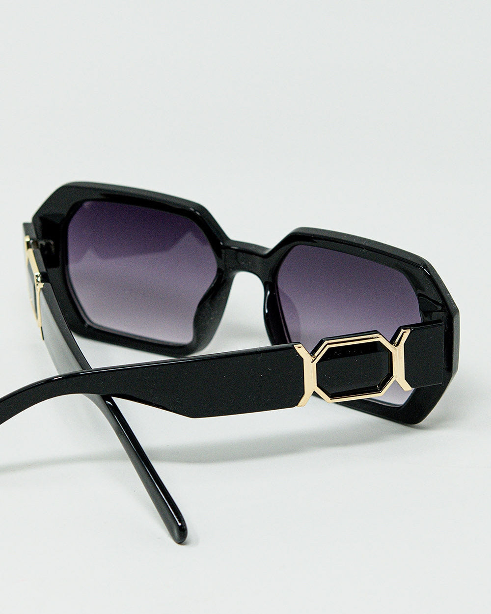Black Diamond-Shaped Sunglasses and Goldden Detail
