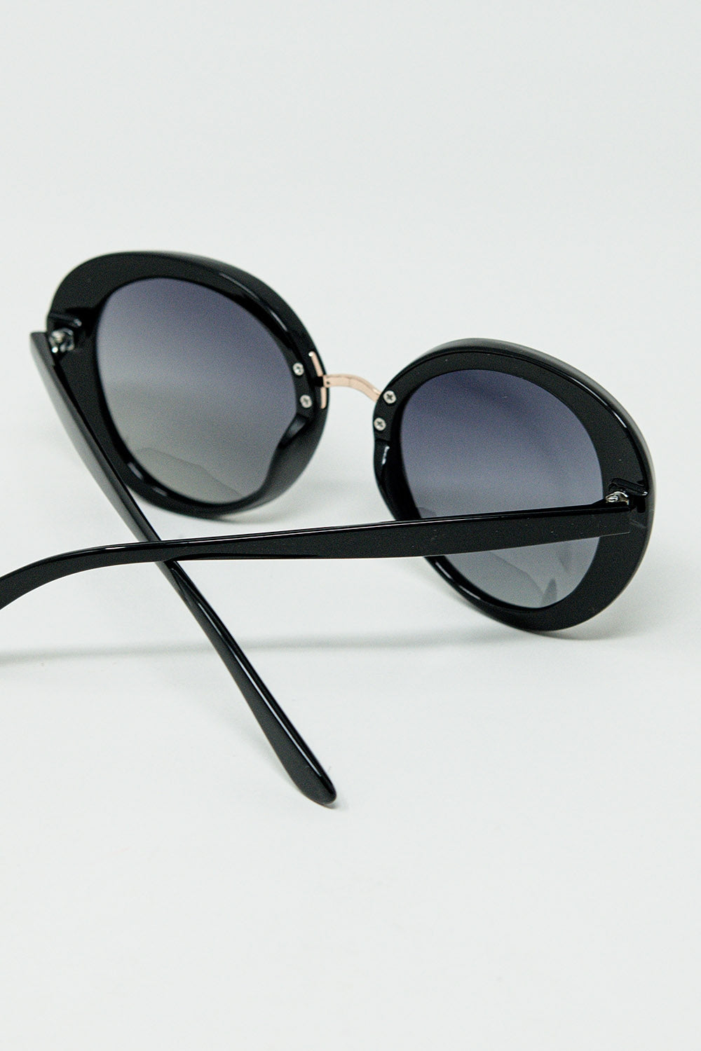 Black Oval Shaped Sunglasses with Metal Gold Detail