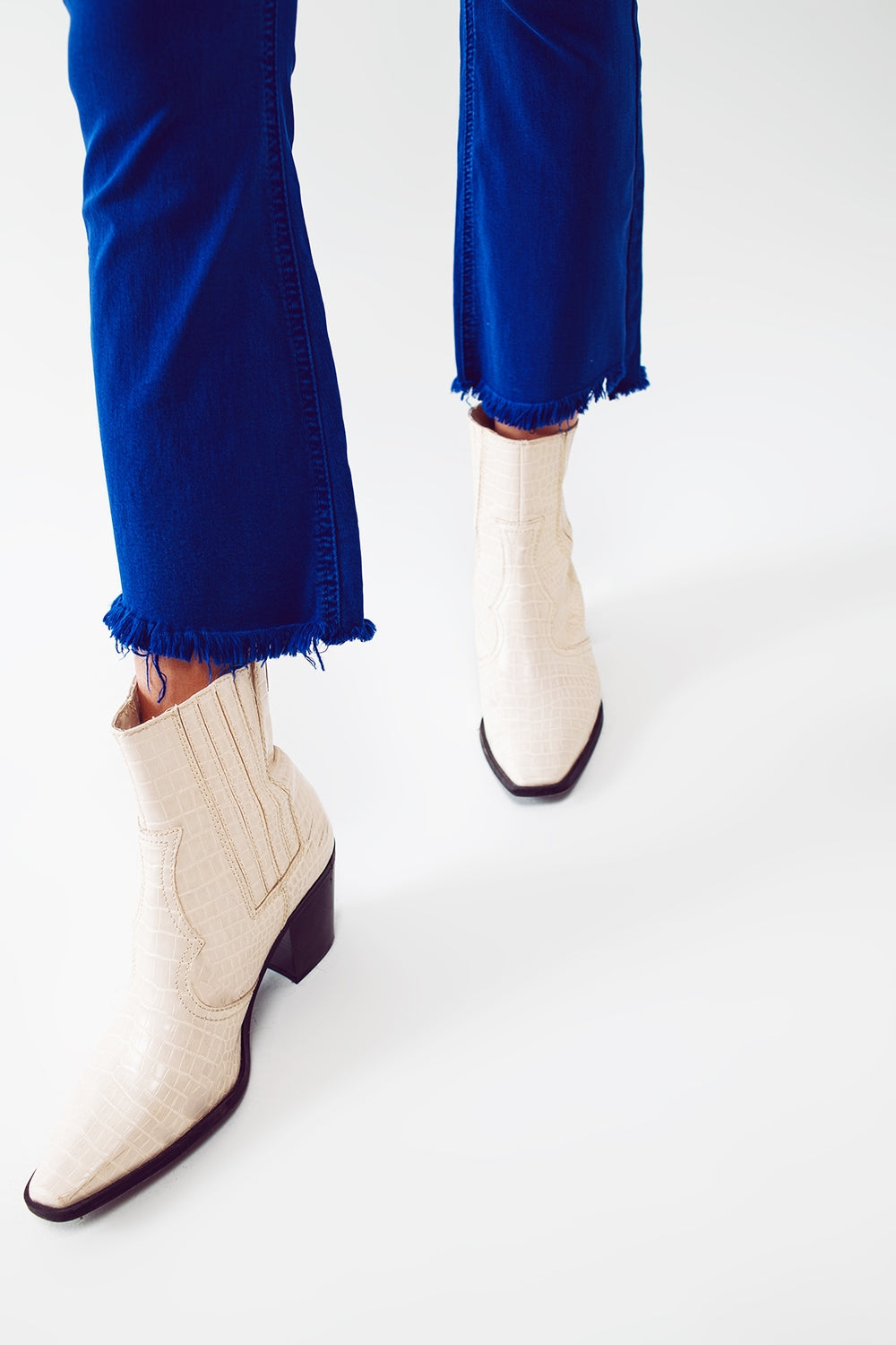 Flare Jeans with Raw Hem Edge in Blue