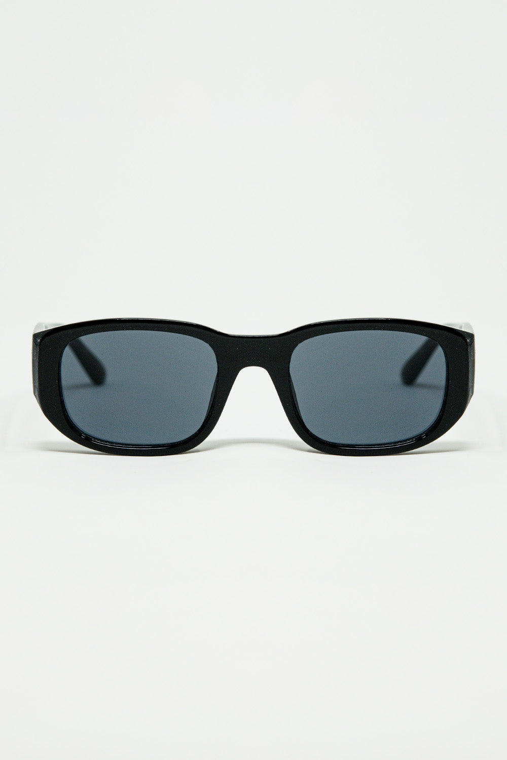 Oval Sunglasses with High Gloss Transparent Frames in Black