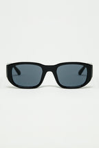 Oval Sunglasses with High Gloss Transparent Frames in Black