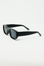 Oval Sunglasses with High Gloss Transparent Frames in Black
