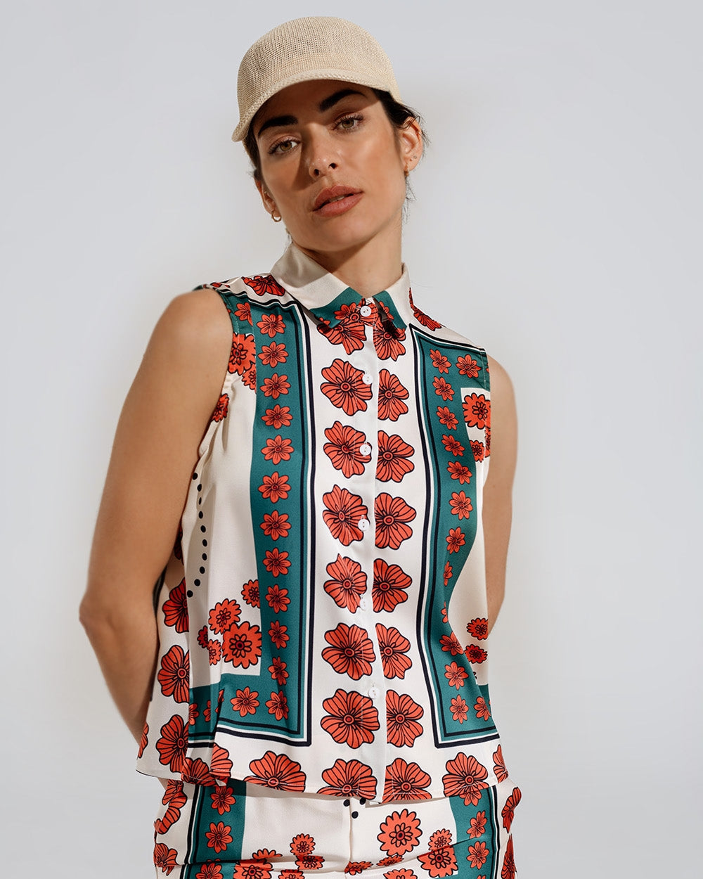 Sleeveless Creme Shirt with Floral Design